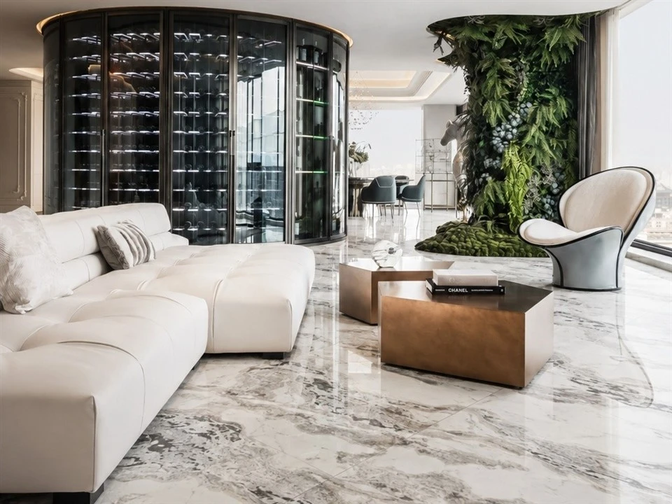 Oyster White Marble floor tiles installed in a luxury living room with polished surfaces and visible stone variation