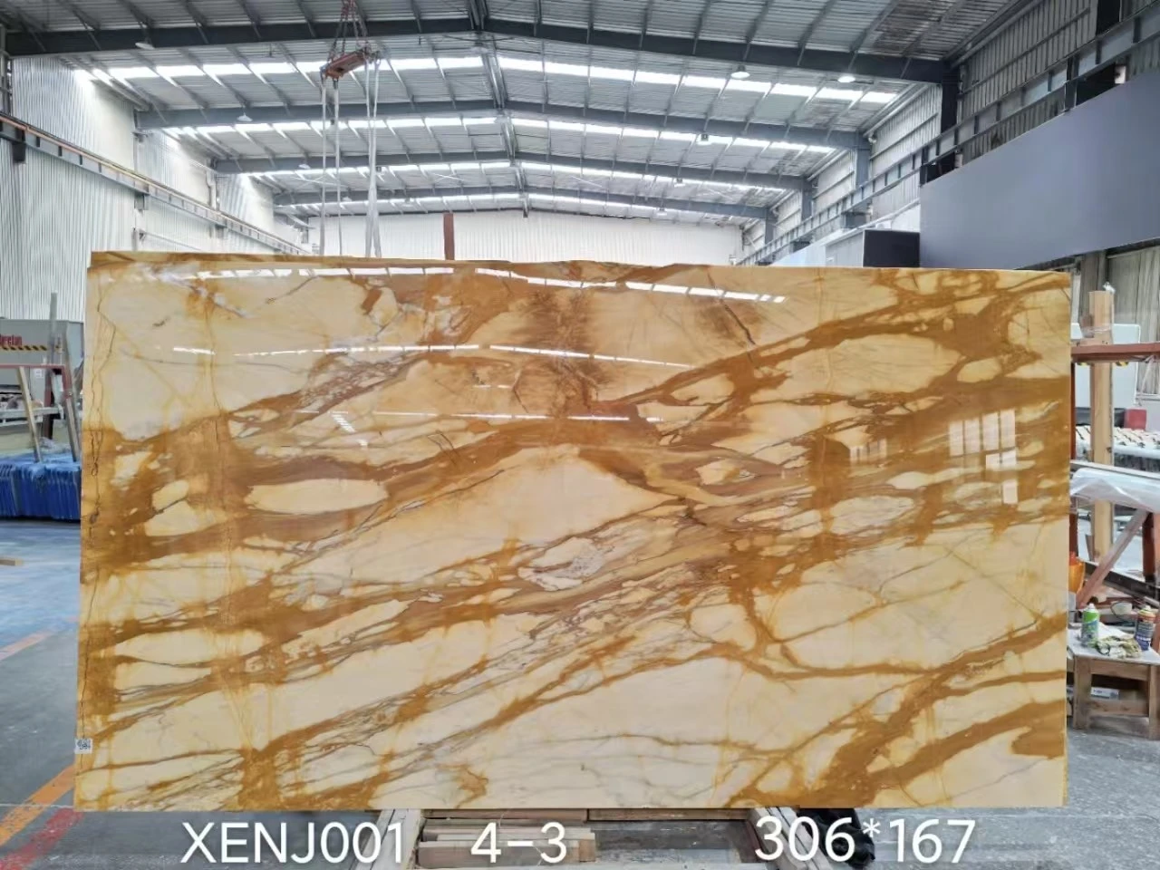 Giallo Siena Marble slab with a golden cream background and dramatic brown veining displayed at Landiview Stone factory Giallo Siena Marble slab with a golden cream background and dramatic brown veining displayed at Landiview Stone factory